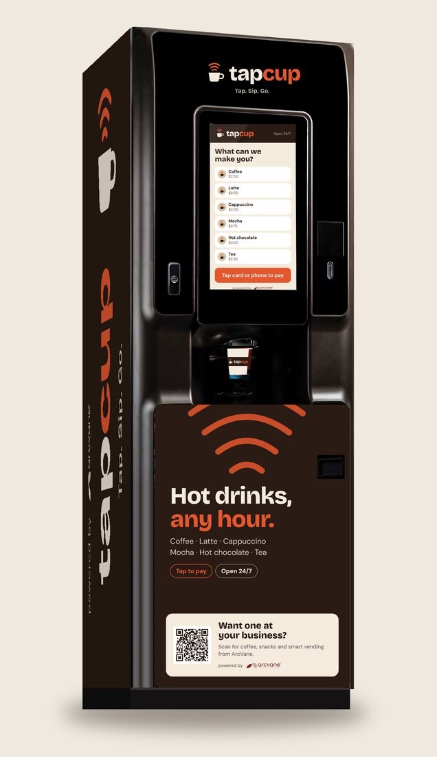 Coffee machine wrapped in the TapCup brand, with a touchscreen menu and a QR card